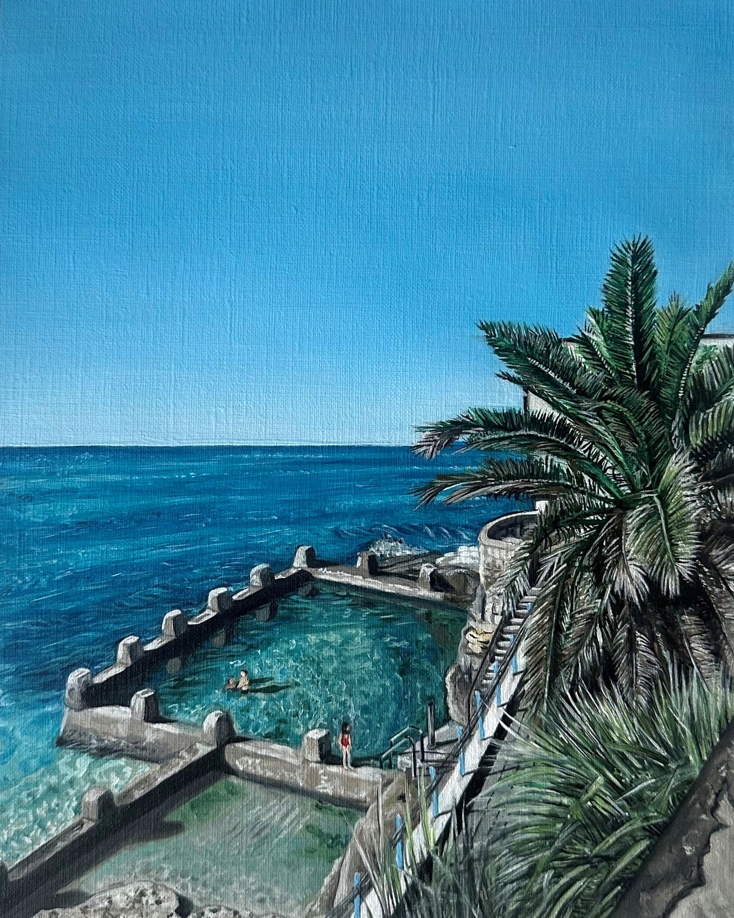 An original oil painting depicting Coogee Beach and Ocean Pool with a clear blue sky, palm trees, and people in the background.